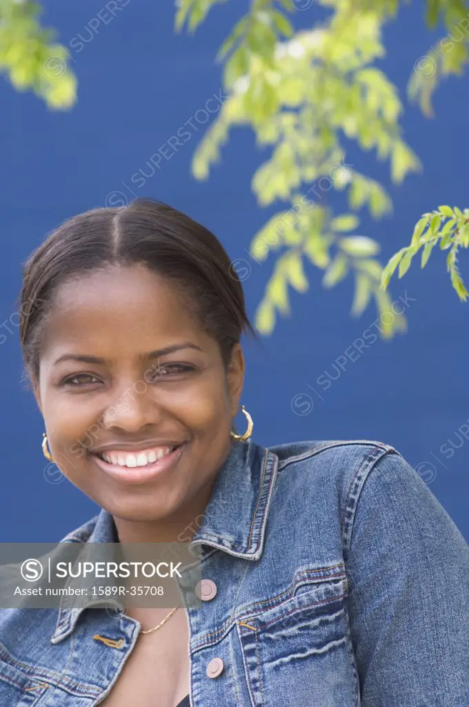 African woman smiling outdoors