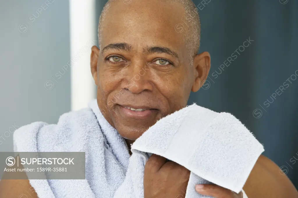 Close up of senior African man with towel
