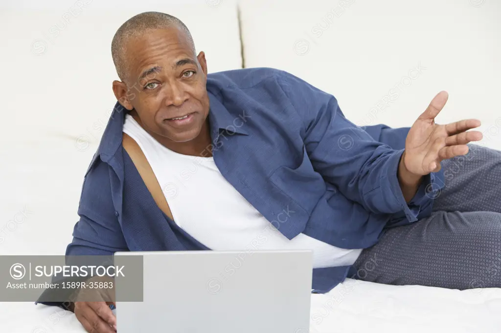 Senior African man with laptop