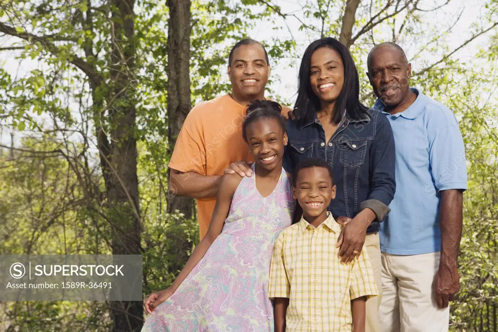 Multi-generational African family smiling in park
