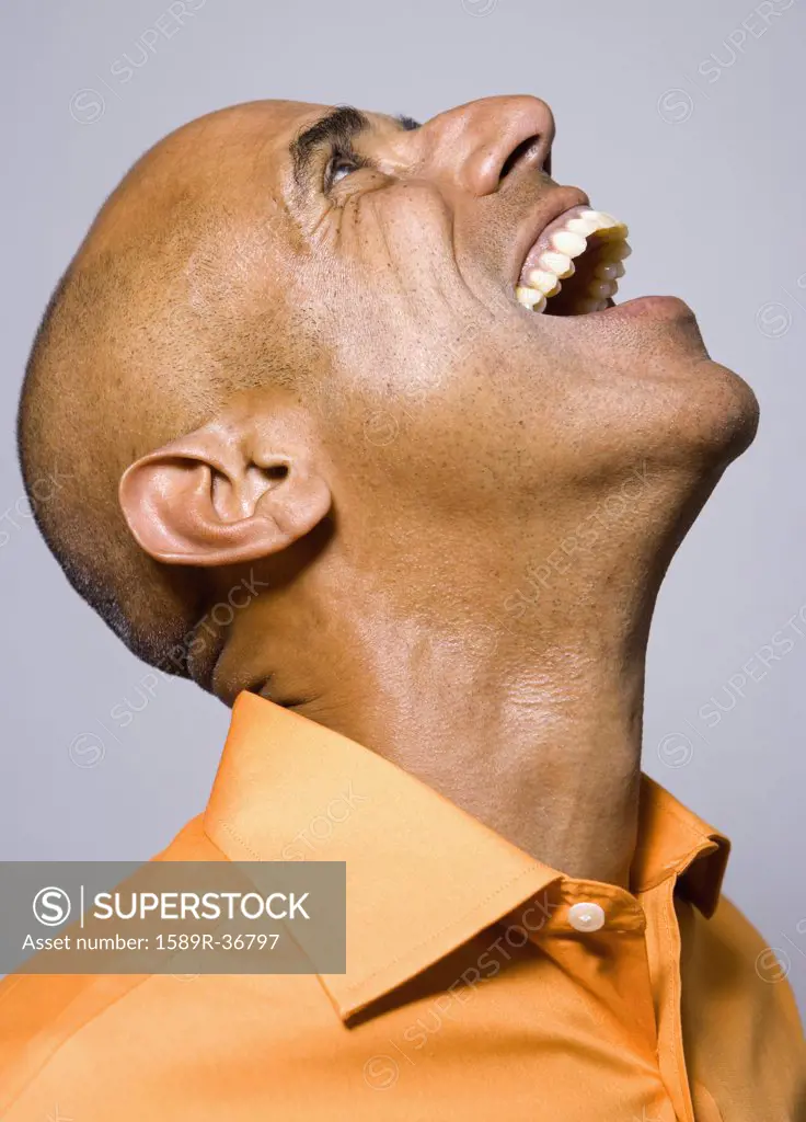 Portrait of African man laughing and looking up