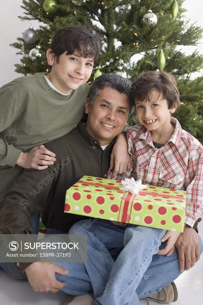 Hispanic father and sons on Christmas