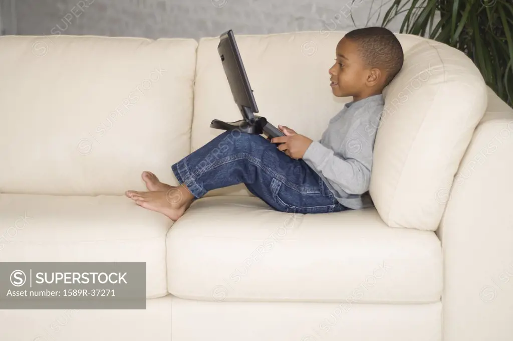 African boy looking at laptop