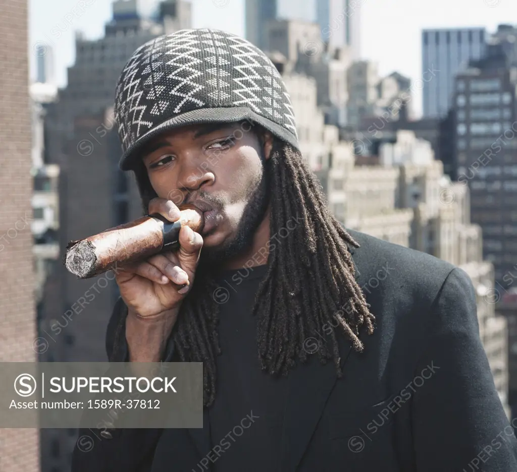 African man smoking large cigar