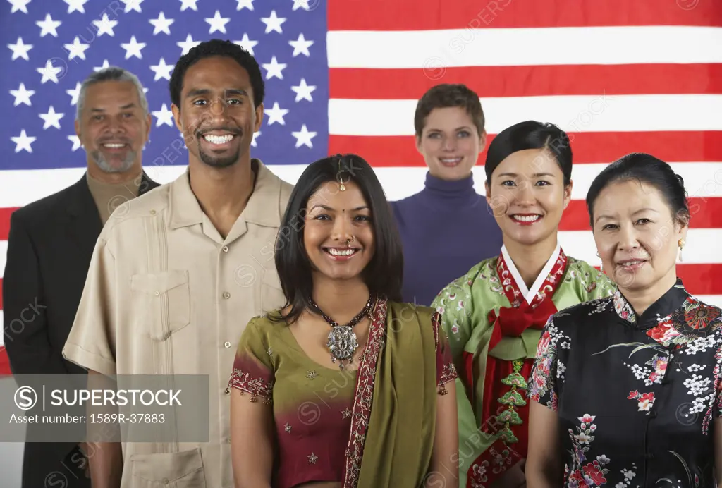 Ethnic-ethnic people standing in front of American flag