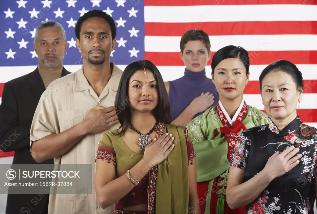 Ethnic-ethnic people standing in front of American flag