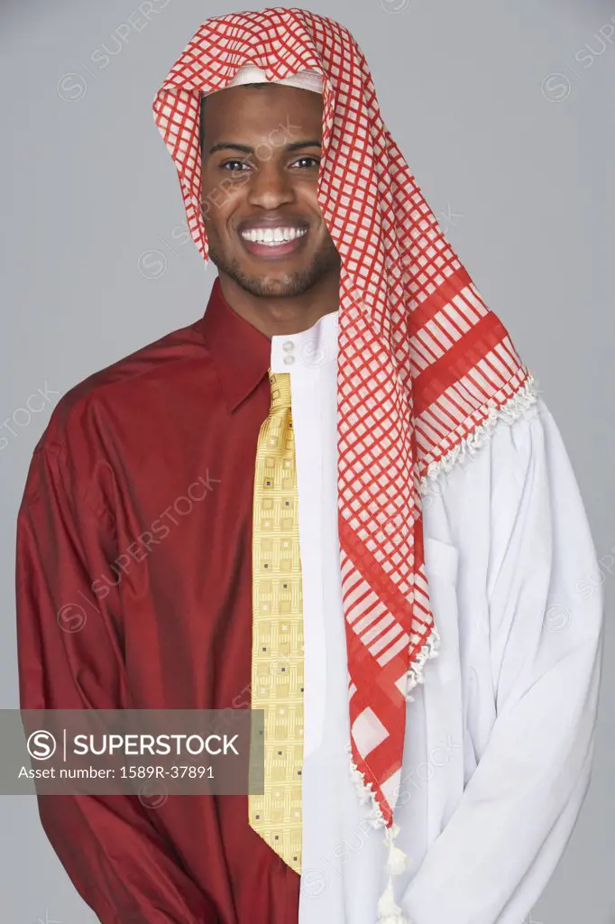 Middle Eastern man wearing traditional dress and business attire