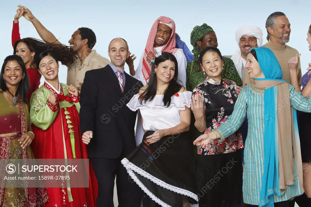 Ethnic-ethnic people in traditional dress dancing