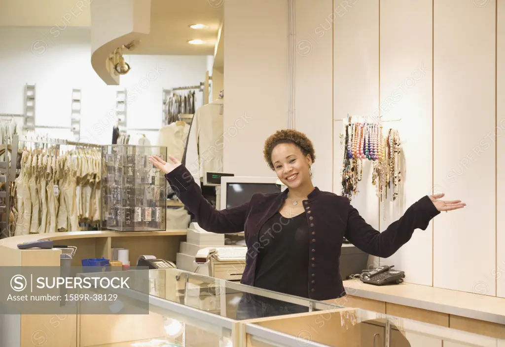Mixed Race woman working in boutique