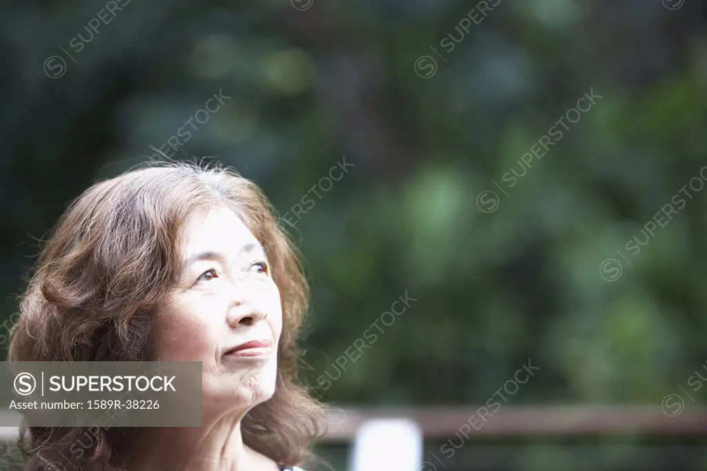 Senior Asian woman looking to side