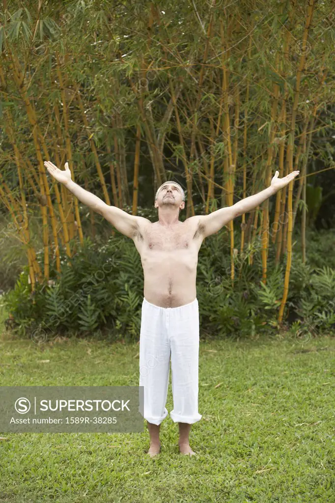 Senior man practicing yoga