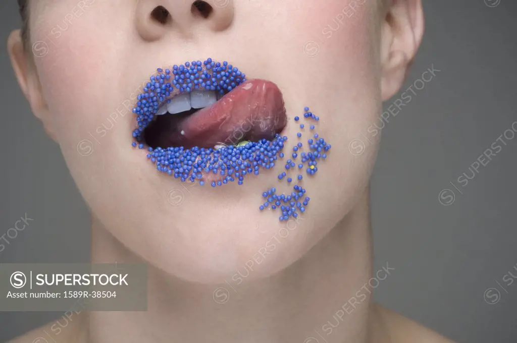 Woman licking sprinkles off lips