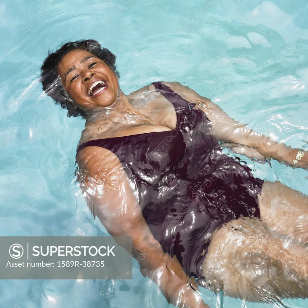 Senior Mixed Race woman in swimming pool