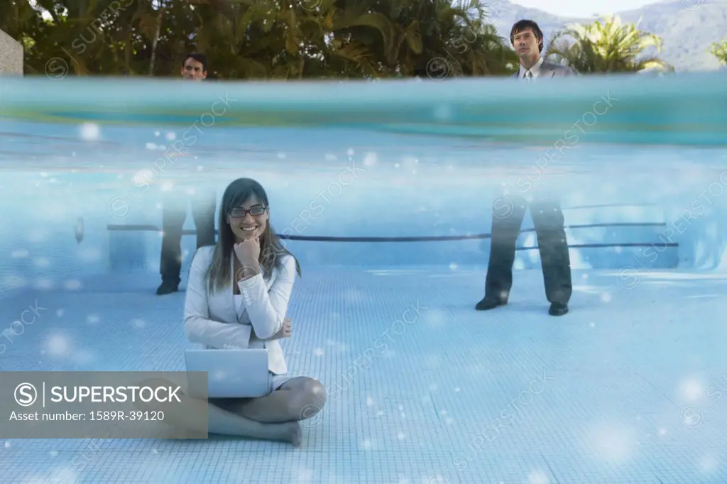 South American businesspeople in swimming pool
