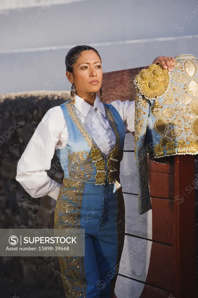 Hispanic woman wearing toreador outfit