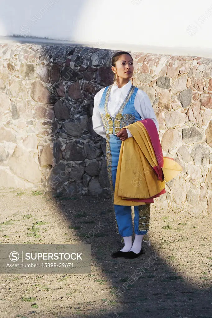 Hispanic woman wearing toreador outfit