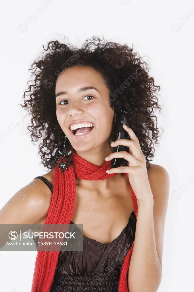 Mixed Race woman talking on cell phone