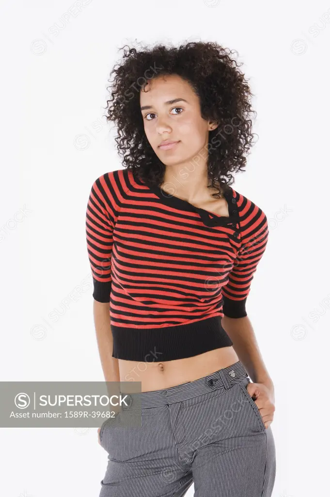Mixed Race woman with hands in pockets