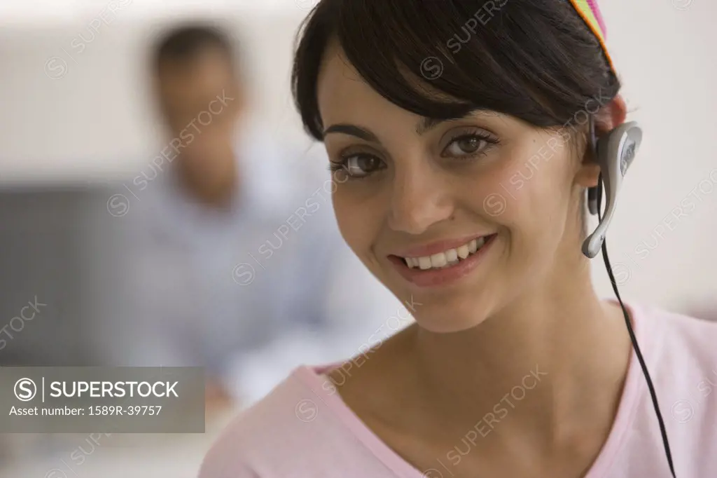 Young woman wearing headset