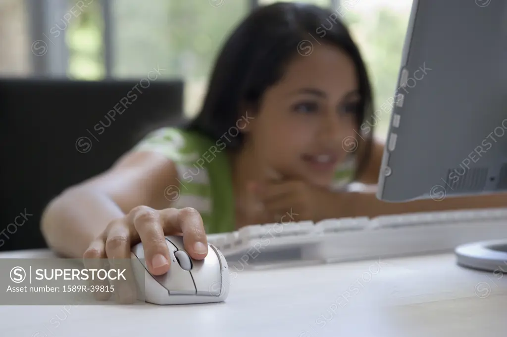 Young woman looking at looking at computer