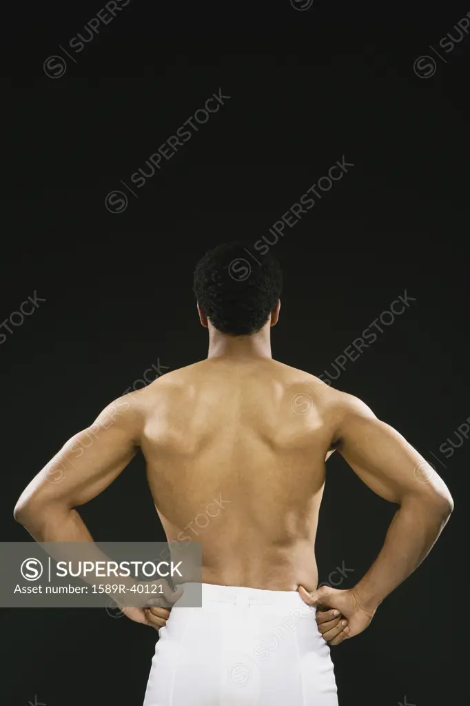 Rear view of African American man wearing towel