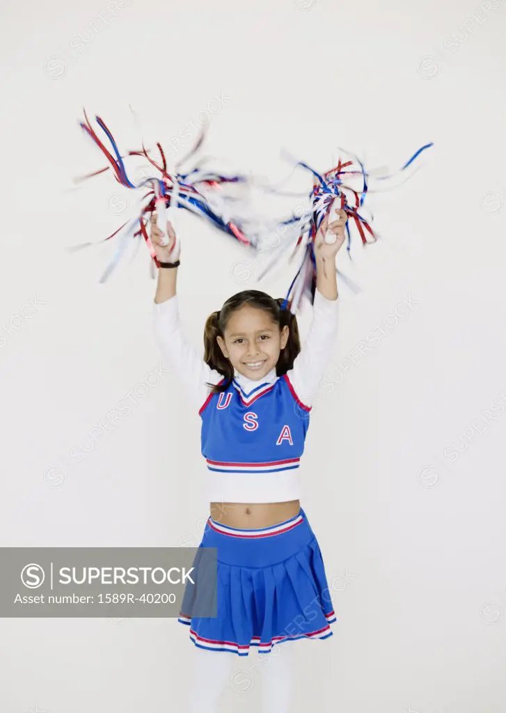 Hispanic girl dressed as cheerleader