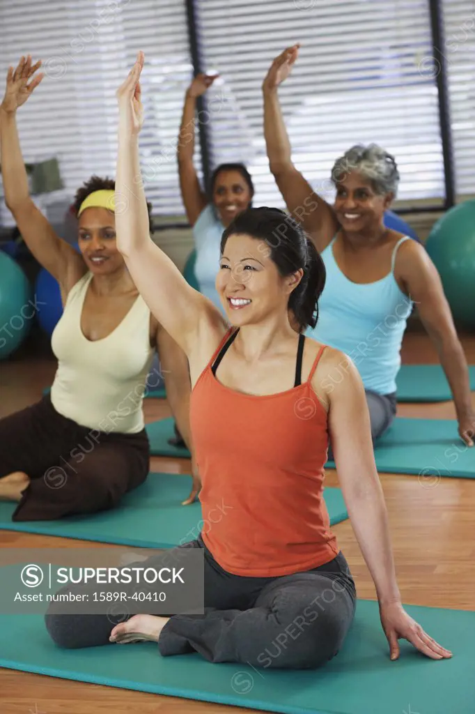 Multi-ethnic women in yoga class