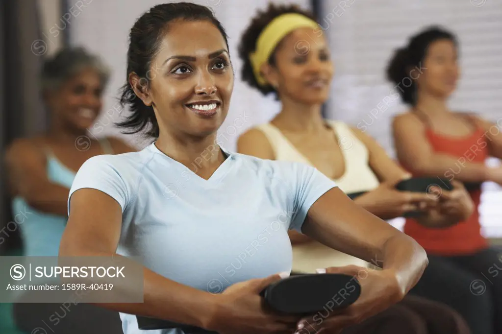 Multi-ethnic women in exercise class