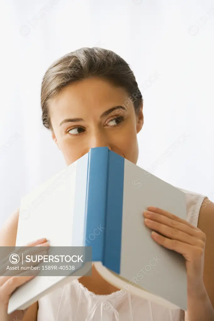 Woman holding open book