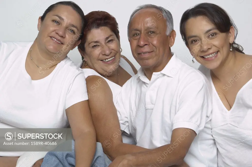 Portrait of Hispanic parents and adult daughters