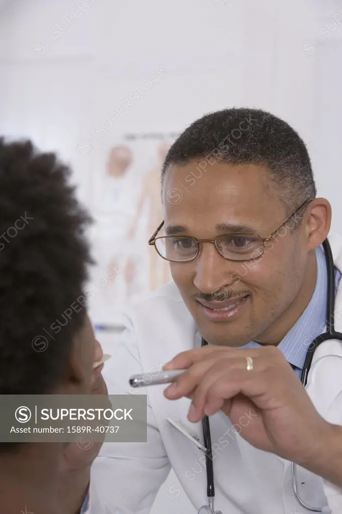 Female doctor putting on surgical gloves