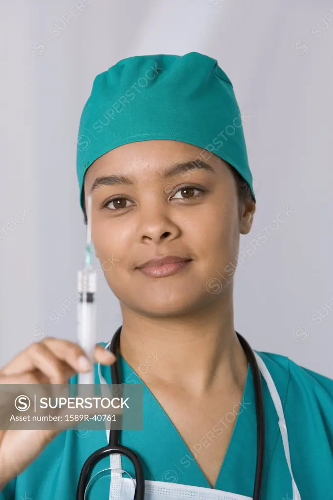 African female doctor holding syringe