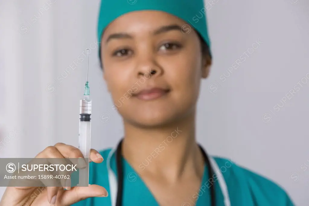 African female doctor holding syringe