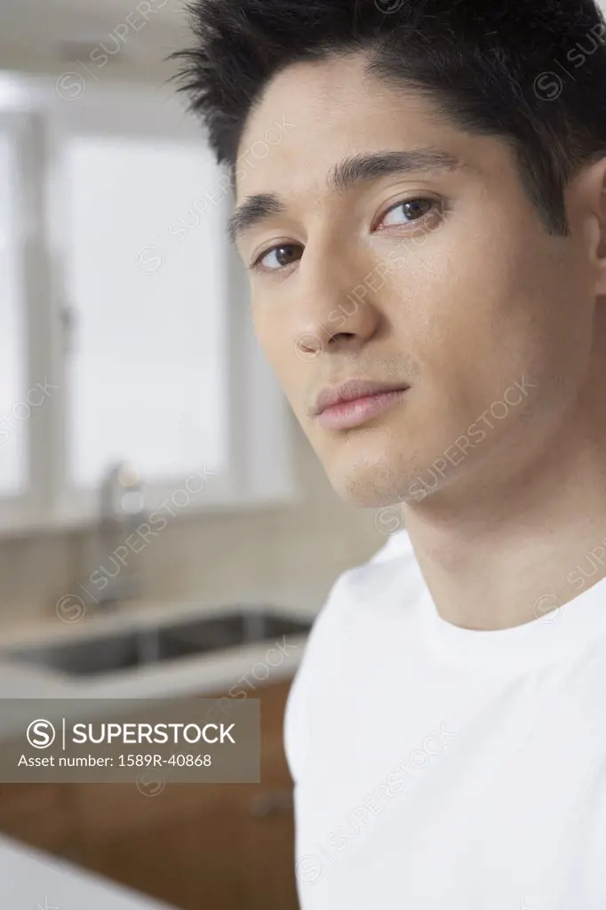 Close up of Asian man in kitchen