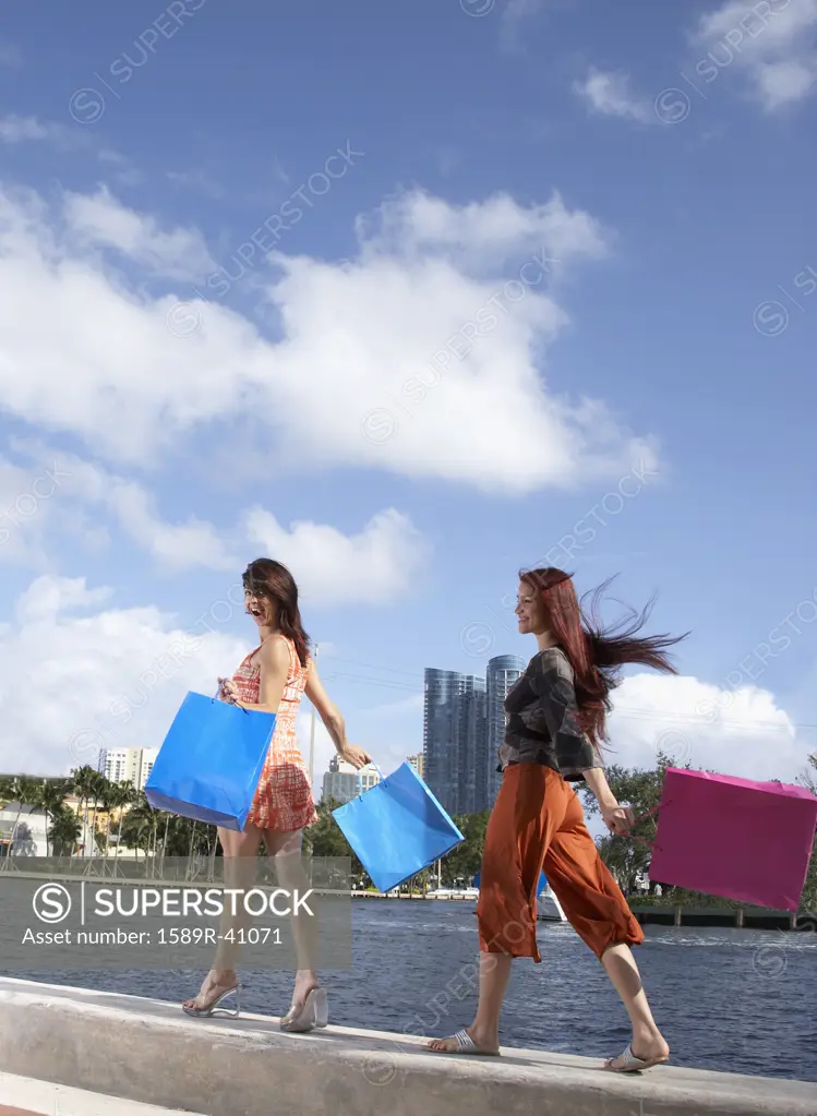Multi-ethnic friends carrying shopping bags