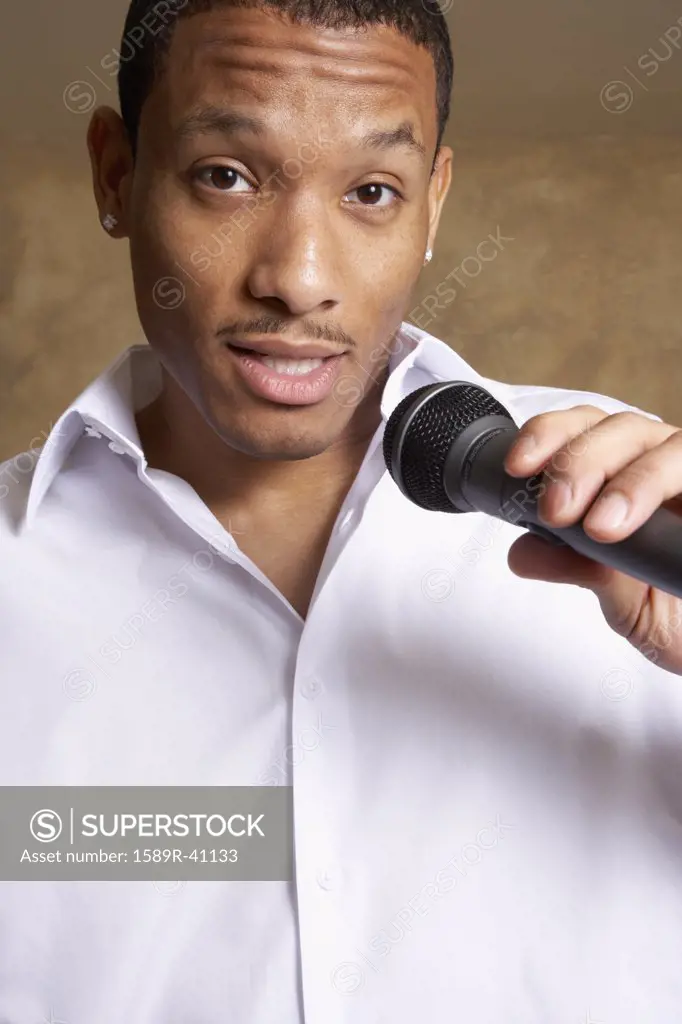 African man singing into microphone
