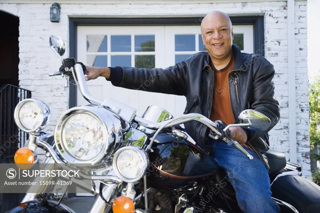 Senior African American man sitting on motorcycle