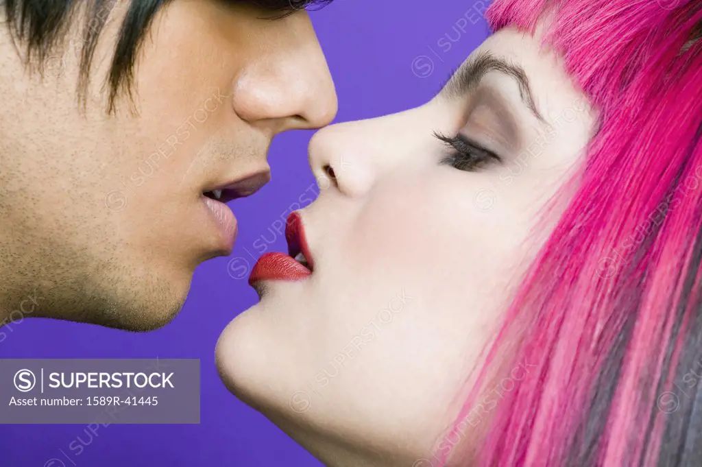 Hispanic couple about to kiss