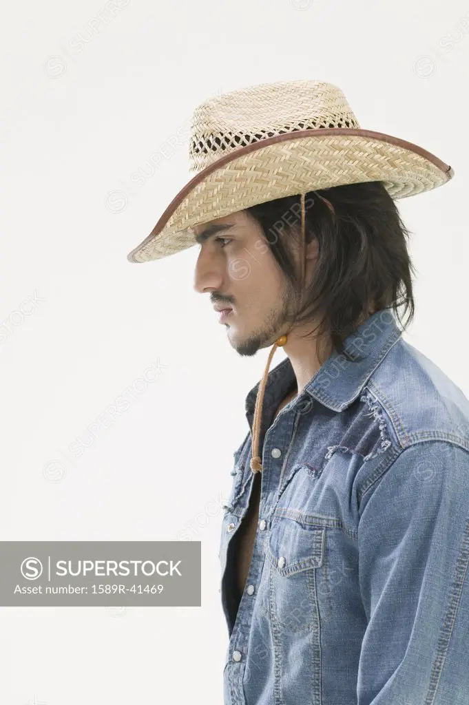 Hispanic man wearing cowboy hat