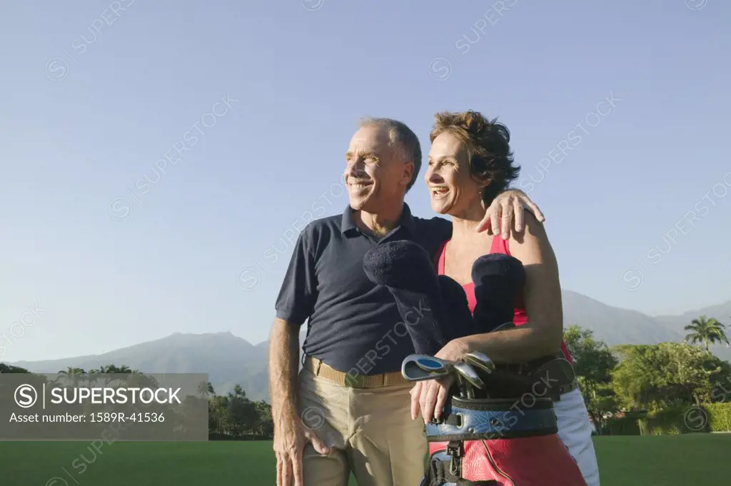 Multi-ethnic couple on golf course