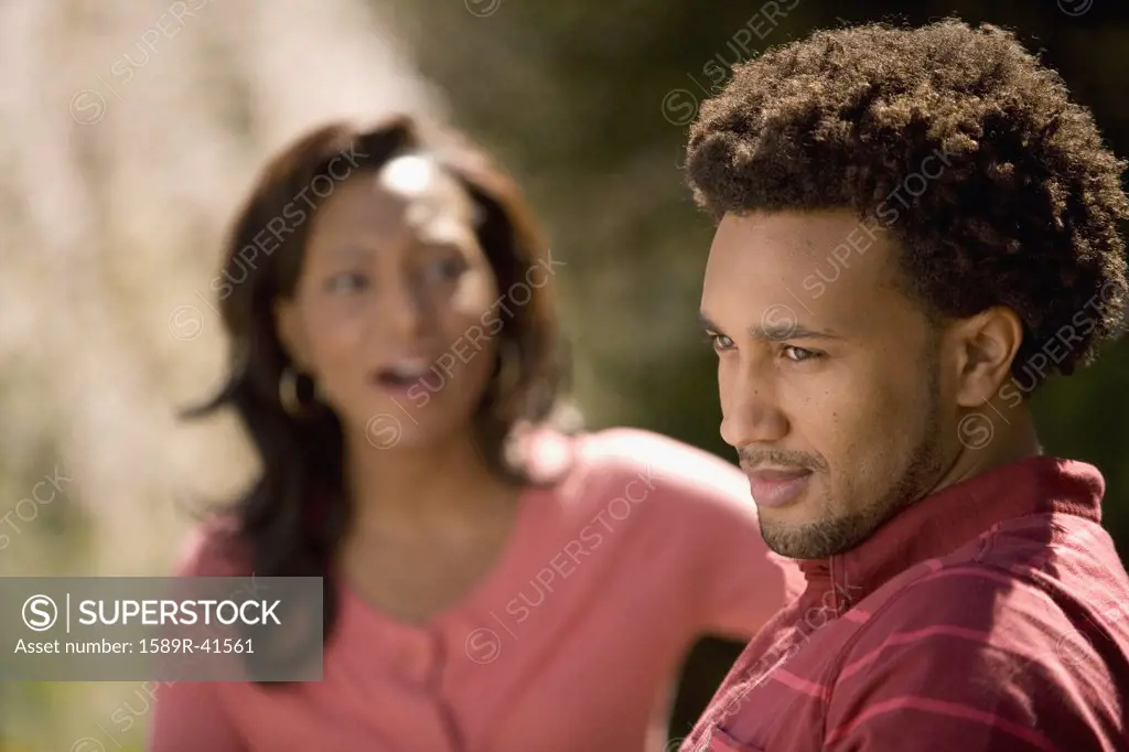 African American man ignoring girlfriend