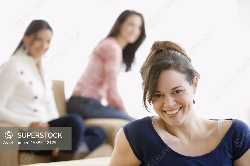 Hispanic woman with friends in background