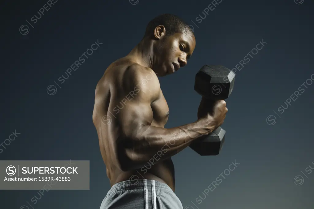 African American man lifting weights