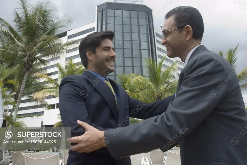 Hispanic businessmen shaking hands