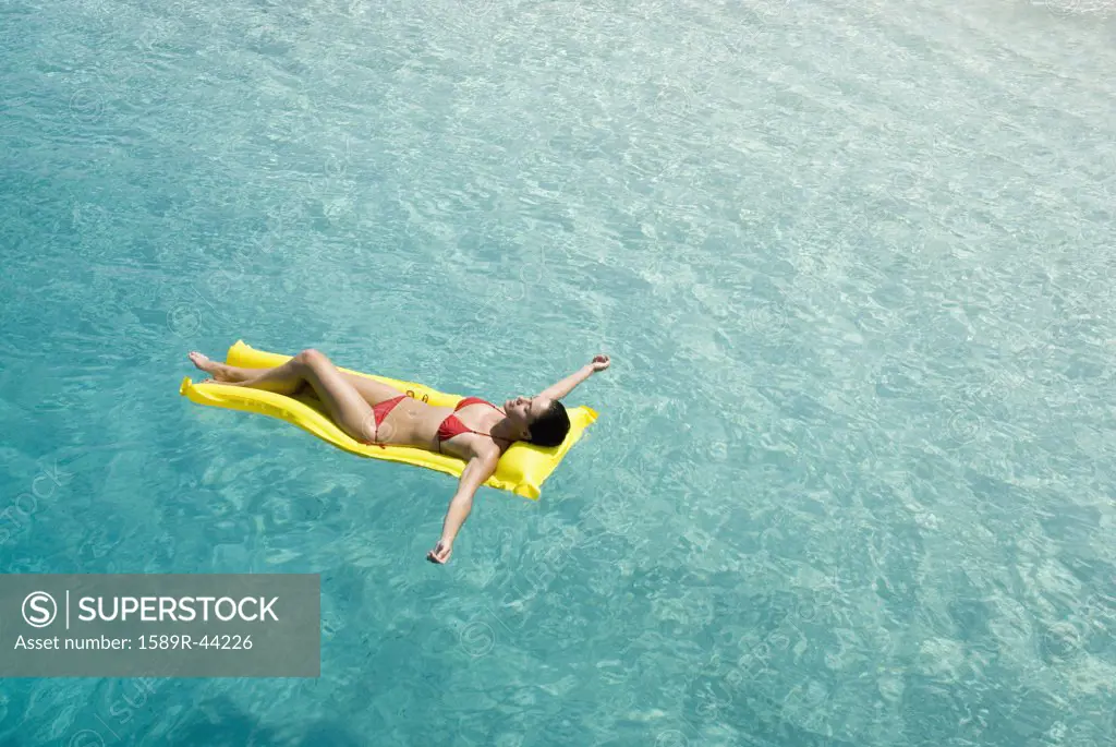 Woman on float in water