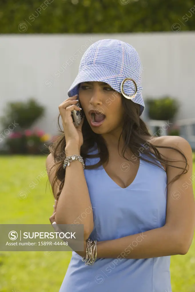 Hispanic woman talking on cell phone