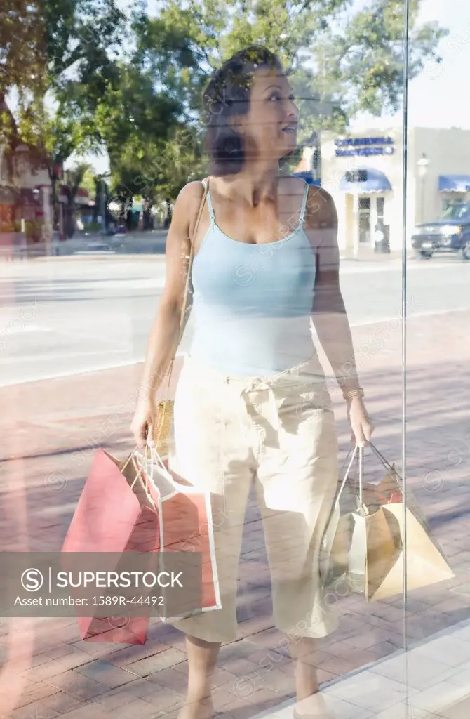 Hispanic woman window shopping