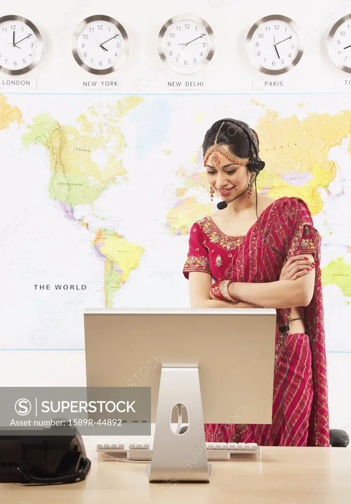 Indian businesswoman wearing headset