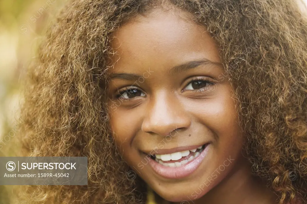 Close up of African American girl smiling