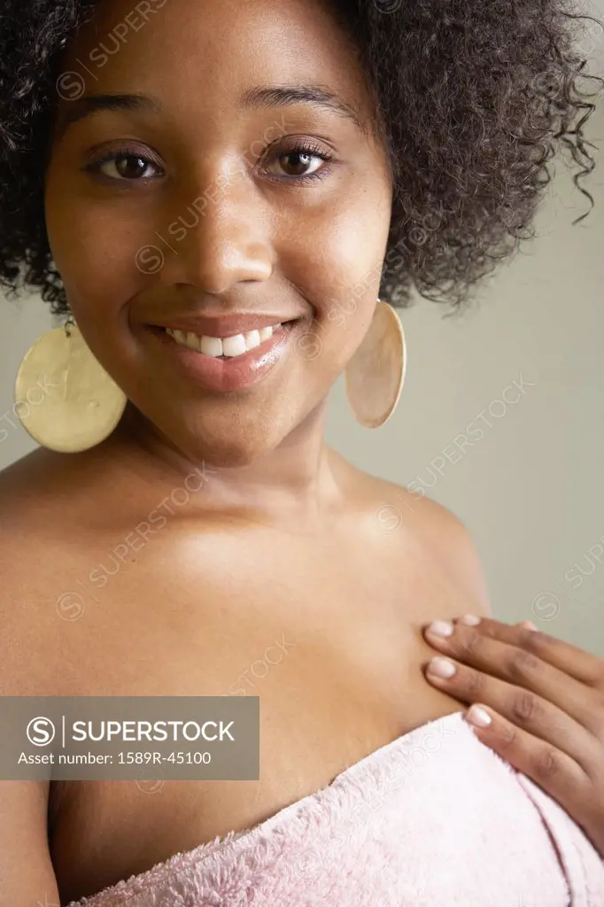 African woman wrapped in towel